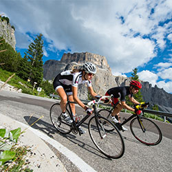 Cyclists coming down a hill in the Aosta Valley