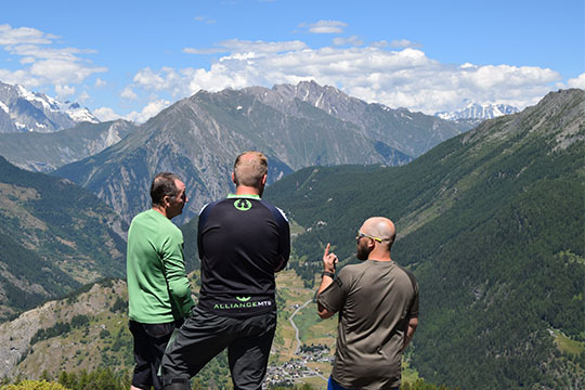 Alpine Revolution Staff looking over mountains